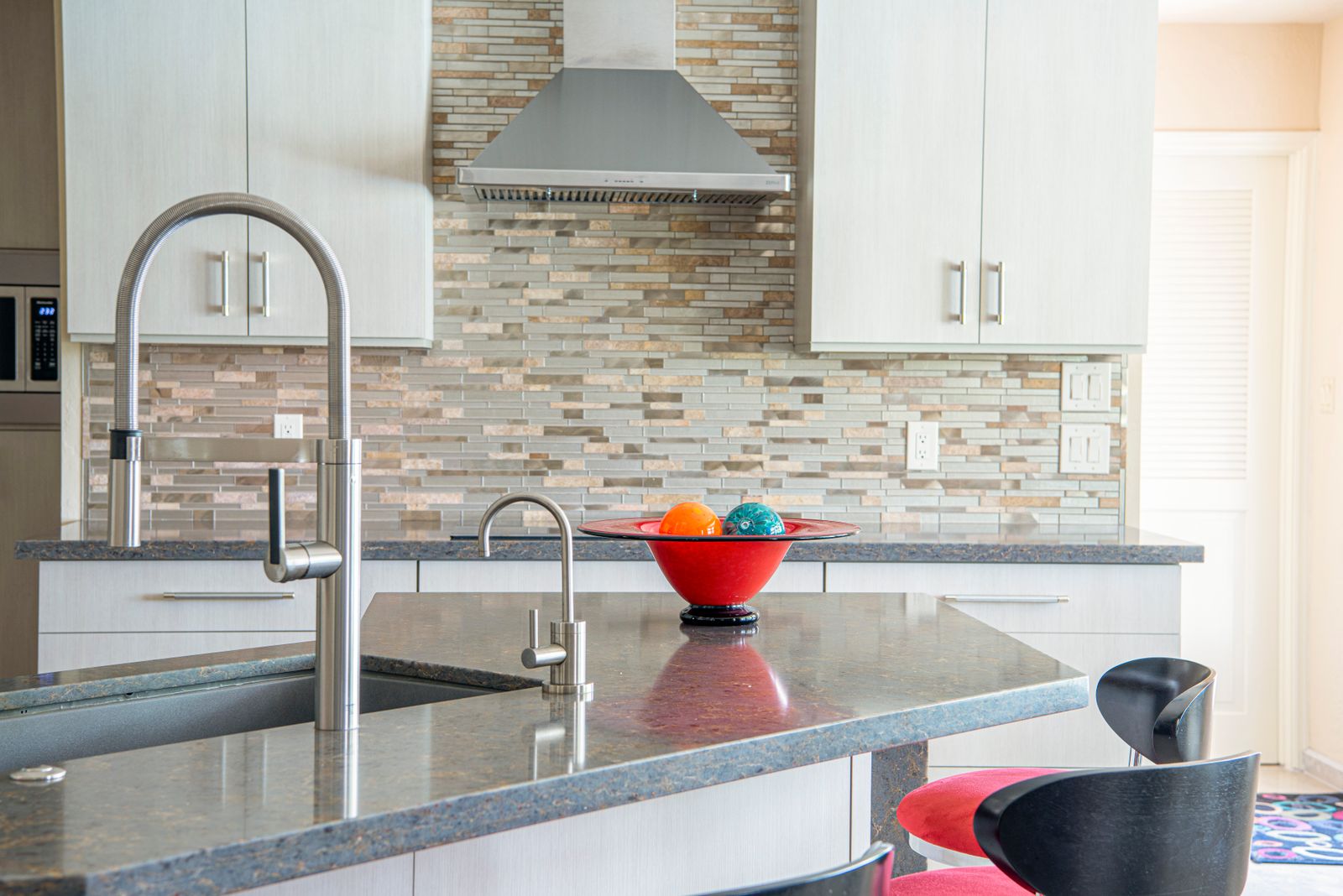 Sleek kitchen faucet installed on a granite countertop